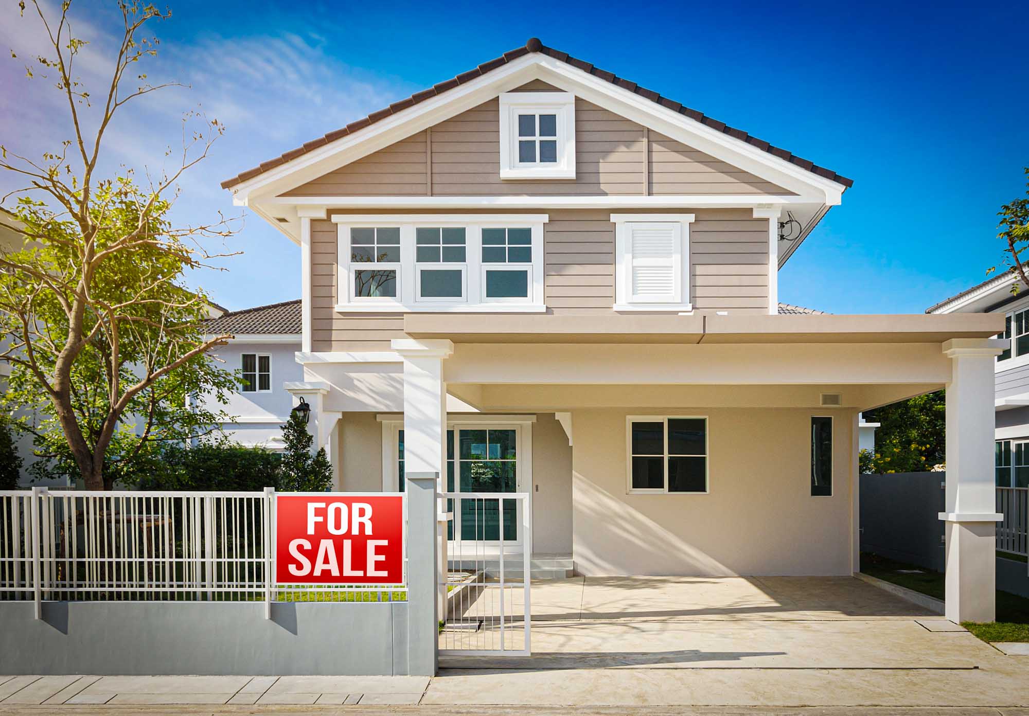 Older home with a For Sale sign — houses built before 1978 are likely to contain lead paint on walls, trim, windows, and doors, making lead testing essential before buying or renovating