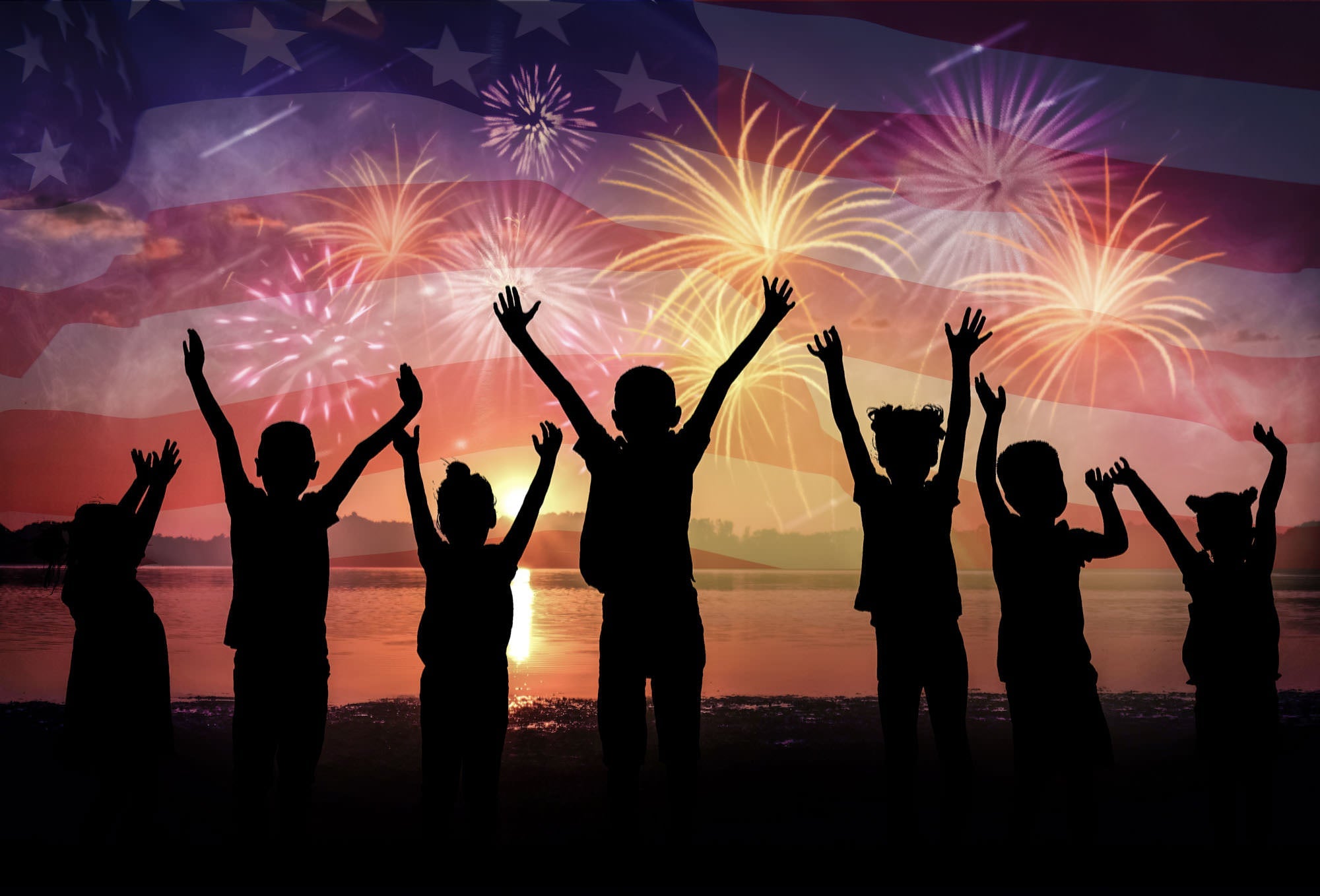 Families celebrating with fireworks against an American flag backdrop — fireworks leave behind lead-containing fallout that settles on soil, grass, and outdoor surfaces where children play
