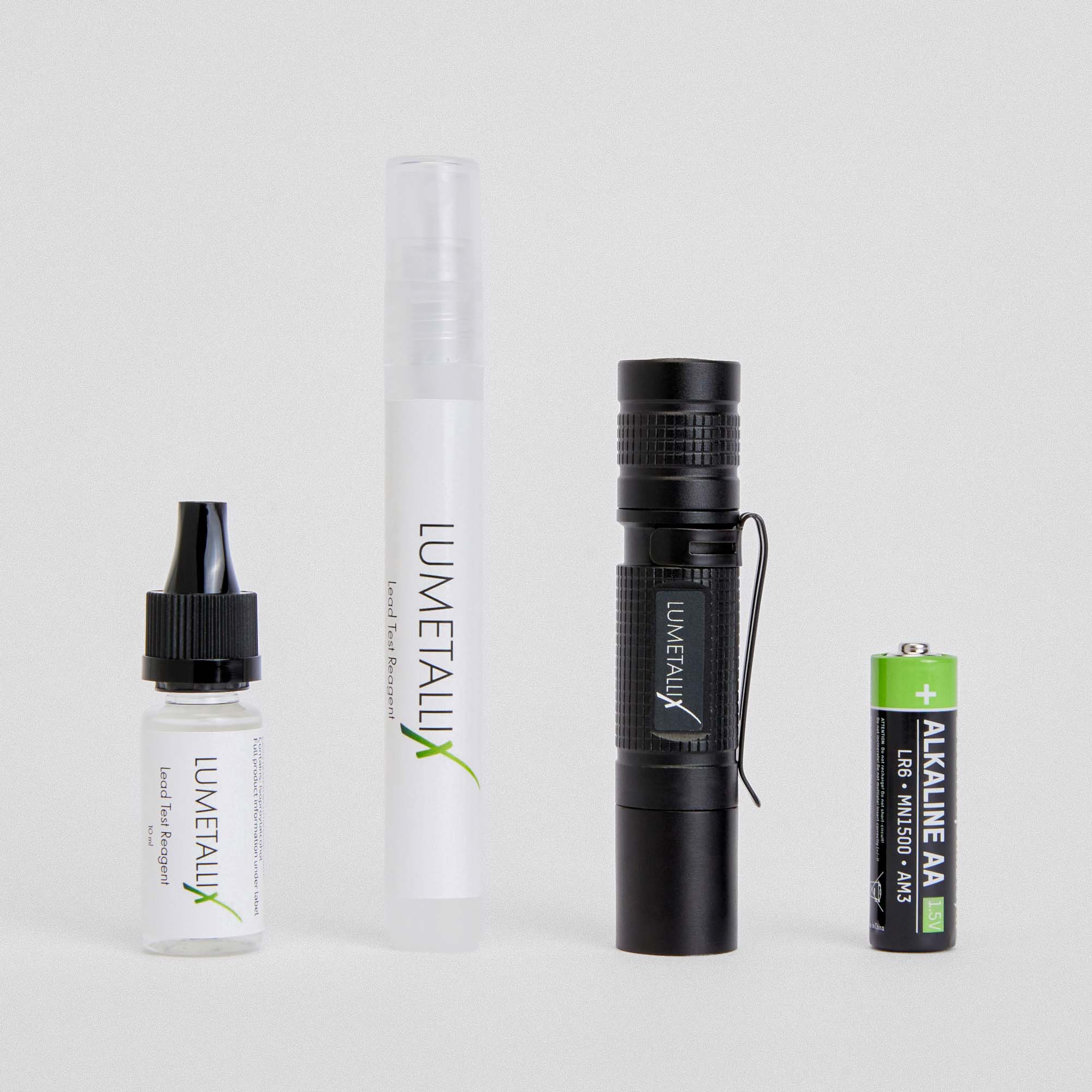 The complete Lumetallix lead test kit: drip bottle reagent, spray bottle reagent, LeadLight UV flashlight, and AA battery. Everything you need to test for lead at home, right out of the box